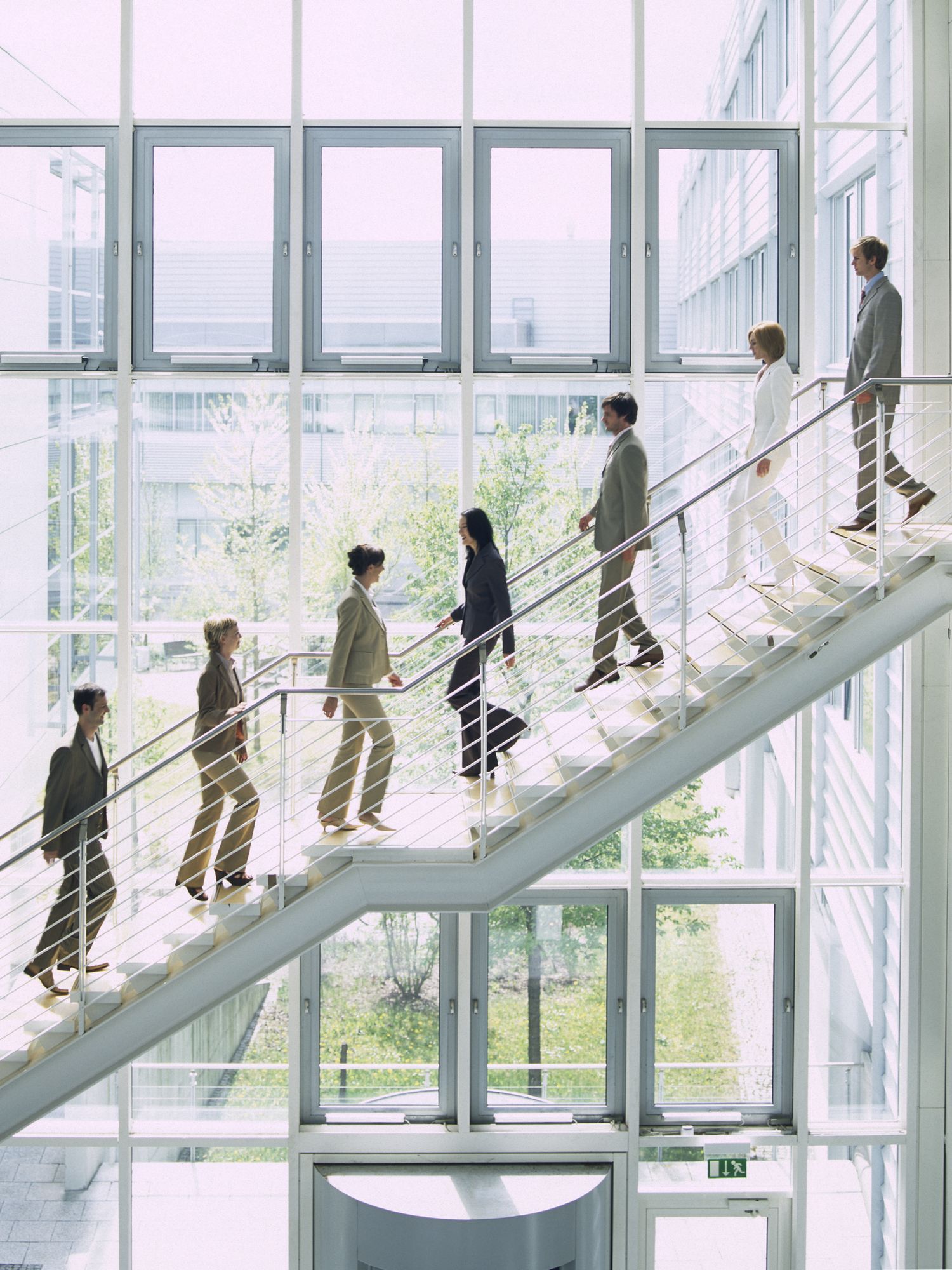 Business people ascending stairs